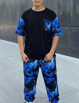 Conjunto de 2 piezas para niño preadolescente, camiseta de manga corta con patrón que brilla en la oscuridad, pantalones de chándal holgados de pie - Shein - FashionsVida