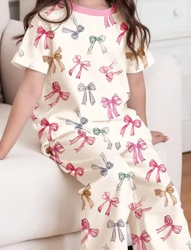 Conjunto de ropa informal de niña preadolescente con blusa de manga corta de cuello redondo con diseño de lazo y pantalón holgado y largo para prim - Shein - FashionsVida