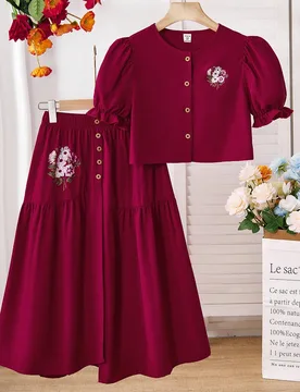 Conjunto de 2 piezas para niña preadolescente con camisa de manga abullonada estampada + falda con botones asimétricos, atuendo cómodo para primave - Shein - FashionsVida