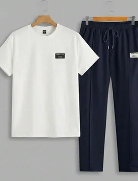 Conjunto de 2 piezas de camiseta de manga corta y pantalones casuales con detalle de parche de eslogan para hombre, primavera/verano, vacaciones, rega - Shein - FashionsVida